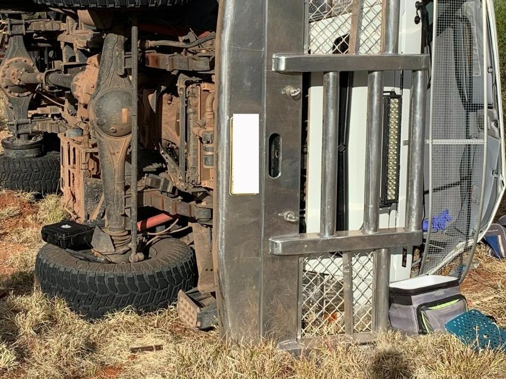 The tour bus laying on its side, following the crash near Hermannsburg. Picture: Joshua Clements.