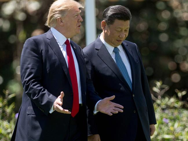 US President Donald Trump (L) and Chinese President Xi Jinping (R) walk together at the Mar-a-Lago estate in Palm Beach, Florida, 2017. US officials said talks between the leaders could happen this week. Picture: AFP