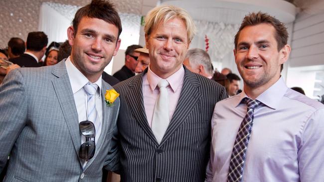 Hodge, right, looking dapper with Dermott Brereton and former Hawk Brent Guerra at the 2010 Melbourne Cup. Picture: David McArthur