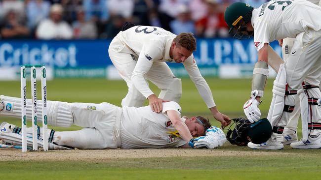 Steve Smith lays on the Lord’s turf after he was struck by Jofra Archer. Picture: AFP