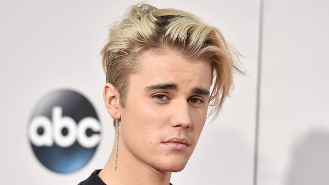 Justin Bieber arrives at the American Music Awards at the Microsoft Theater in Los Angeles. Picture: AP