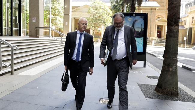 Former CBA chief executive Ian Narev (left) leaving court after giving evidence. Picture: Jane Dempster