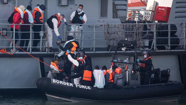 Border Force officials unload migrants intercepted in the English Channel in Dover last month. Picture: Getty Images