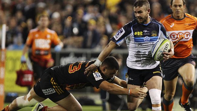 CANBERRA, AUSTRALIA - APRIL 25: Robbie Coleman of the Brumbies is tackled during the round 11 Super Rugby match between the Brumbies and the Chiefs at Canberra Stadium on April 25, 2014 in Canberra, Australia. (Photo by Stefan Postles/Getty Images)