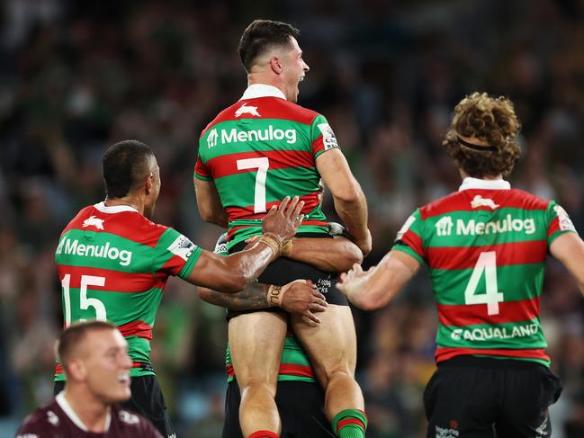 SYDNEY, AUSTRALIA - MARCH 25:  Lachlan Ilias of the Rabbitohs  celebrates with team mates after kicking a field goal in golden point time to win the round four NRL match between South Sydney Rabbitohs and Manly Sea Eagles at Accor Stadium on March 25, 2023 in Sydney, Australia. (Photo by Mark Metcalfe/Getty Images)