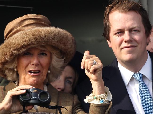 CHELTENHAM, ENGLAND - MARCH 12: Camilla, Duchess of Cornwall and Tom Parker Bowles watch the first race, Camilla, Duchess of Cornwall celebrates winning the race on Ladies Day, day 2 of The Cheltenham Festival at Cheltenham Racecourse on March 12, 2014 in Cheltenham, England. (Photo by Danny E. Martindale/Getty Images)