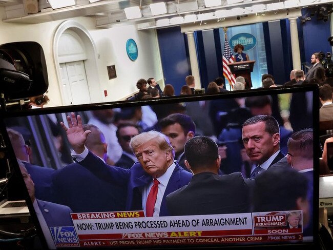 A television screen displays a picture of Donald Trump in the White House press briefing room, April 4. PHOTO: KEVIN DIETSCH/GETTY IMAGES