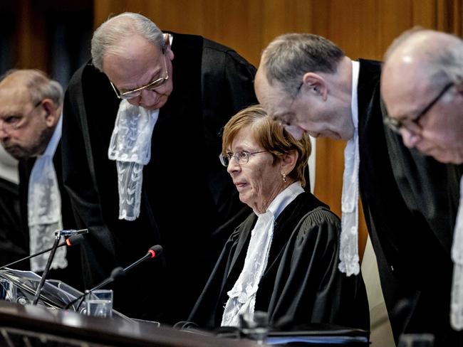 ICJ President Joan Donoghue (C) and ICJ judges arrive at the International Court of Justice (ICJ) prior to the verdict announcement in the genocide case against Israel, brought by South Africa, in The Hague on January 26, 2024. The top UN court said Israel should do everything it could to prevent any acts of genocide in the Gaza Strip, in a highly anticipated ruling. Israel must do everything to "prevent the commission of all acts within the scope" of the Genocide Convention, said the International Court of Justice on January 26, 2024. (Photo by Remko de Waal / ANP / AFP) / Netherlands OUT