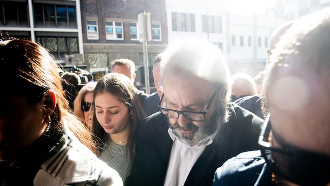 Brett Button arrives at Newcastle court surrounded with family and friends. He has since pleaded guilty to 10 counts of dangerous driving occasioning death and other traffic offences relating to 25 survivors. Picture: NCA NewsWire / Jeremy Piper