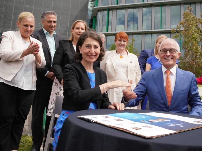 NSW Premier Gladys Berejiklian and Prime Minister Malcolm Turnbull sign the Western Sydney City Deal. Picture: AAP/Ben Rushton