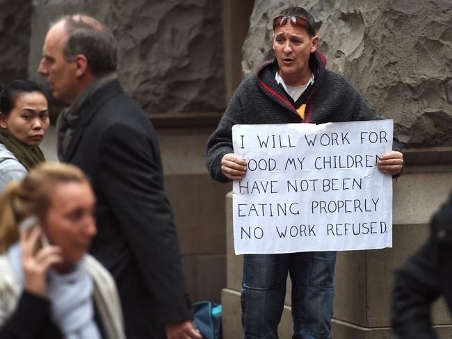 A man searches for work in Sydney last month. Picture: AFP Photo/William West