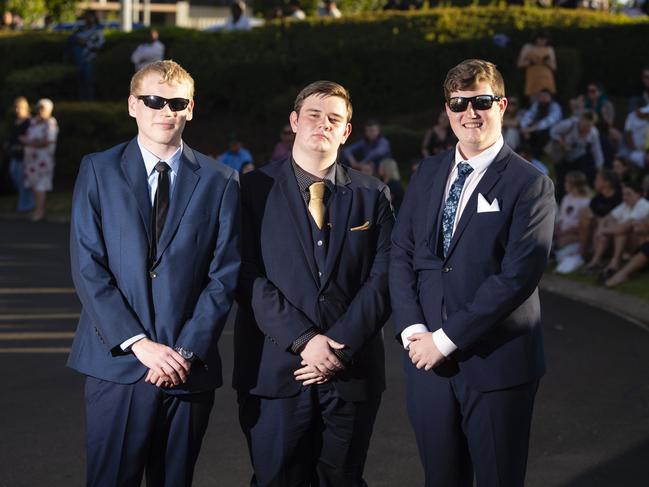 Arriving at Harristown State High School formal are (from left) Alex Anderson, Logan Coonan and Liam Lawson at Highfields Cultural Centre, Friday, November 18, 2022. Picture: Kevin Farmer