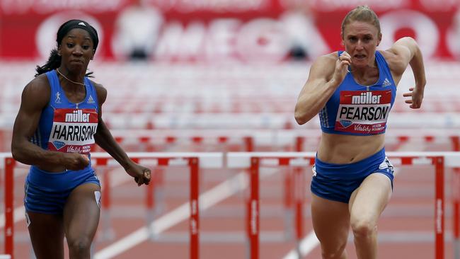 American world record-holder Kendra Harrison, left, holds off Australia’s Sally Pearson to win the women’s 100m hurdles at the Anniversary Games in London yesterday.