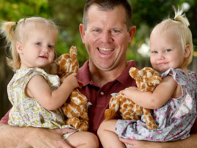 David Jamesion with twins Annabelle and Abigail, 16 months, near their Aitkenvale home. Picture: Evan Morgan