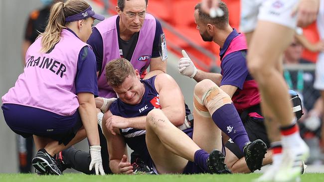 Fremantle’s Sean Darcy gets help from trainers after being bumped in a high shot by St Kilda’s Ben Long. Picture: Michael Klein