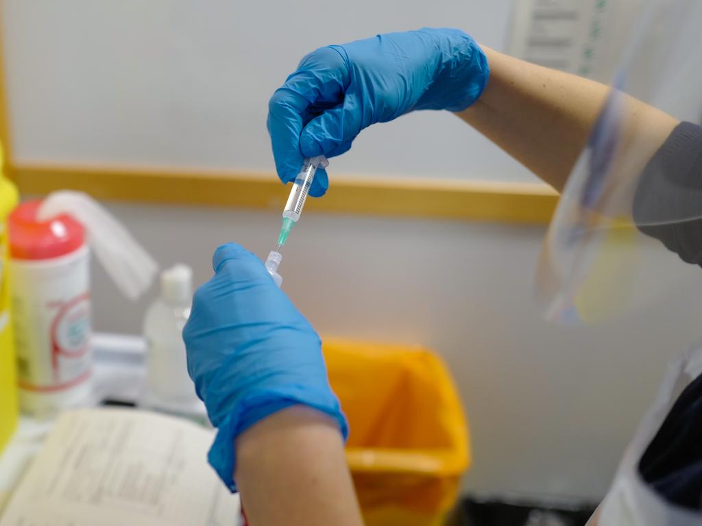 A staff nurse at the Royal Cornwall Hospital prepares to administer COVID-19 vaccinations. Picture: Getty