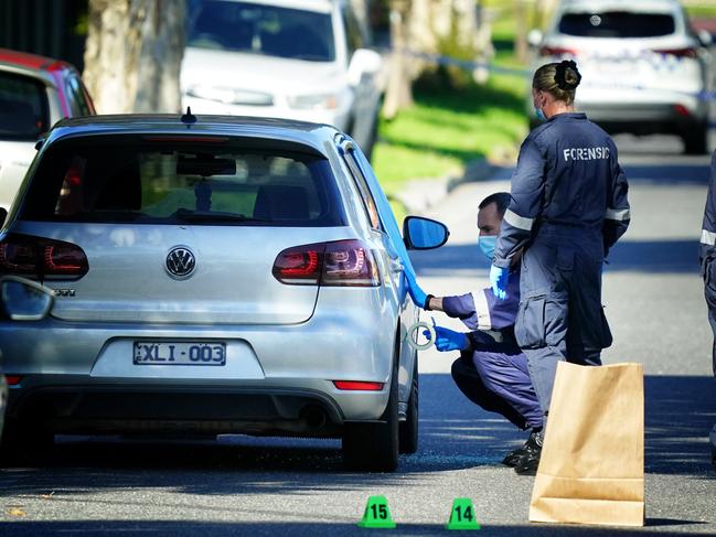 The victim’s car is checked for evidence. Picture: Luis Enrique Ascui