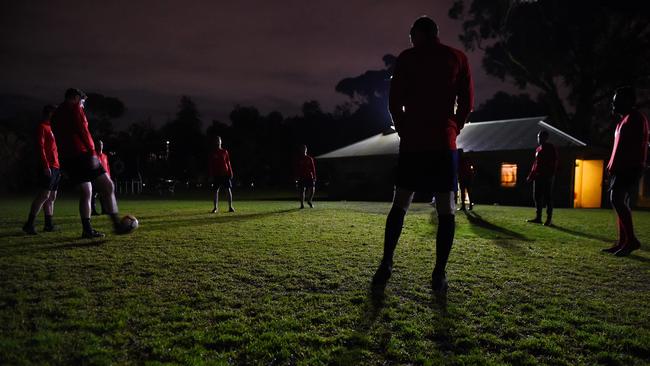 Port Phillip Spiders Soccer Club training in the dark at Lagoon Reserve.