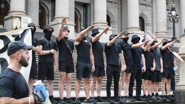 A far right wing group does Nazi salutes on the steps of Victoria’s Parliament in March. Picture: NCA NewsWire / David Crosling