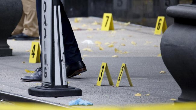 Bullets lying on the sidewalk at the scene outside the Hilton Hotel in midtown Manhattan where Mr Thompson was fatally shot. Picture: AP