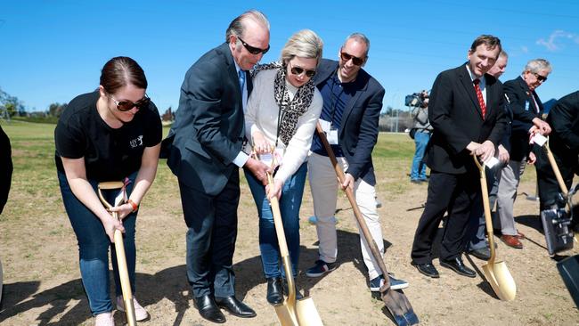 Peter Simpson, Kathryn Szyszka and Angelo Cusumano (centre) and Blacktown Mayor Stephen Bali turn the first sod at Grace's Place in Doonside. Picture: Angelo Velardo