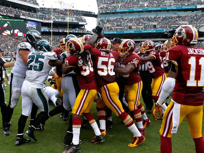 Officials try to break up a scuffle between Washington and the Philadelphia Eagles.