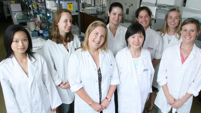 Kathy Belov (centre) with her team at the University of Sydney