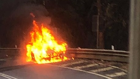 A car erupted in flames on the Kuranda Range Road, blocking traffic in both directions near Henry Ross Lookout. Picture: Grant Turner