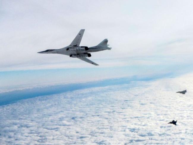 A handout picture released by the British Ministry of Defence shows a Russian TU-160 Blackjack bomber with French Rafale aircraft in the air outside British airspace. Picture: MOD