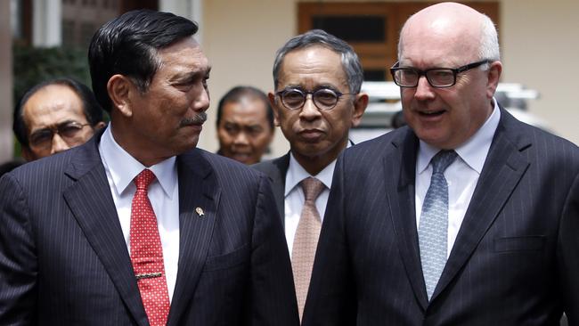 Attorney-General George Brandis, right, meets Indonesia’s Coordinating Minister for Politics Security and Law Luhut Panjaitan, Law and Human Right Minister Yasonna  Laoly, left, and national police chief General Badrodin Haiti.