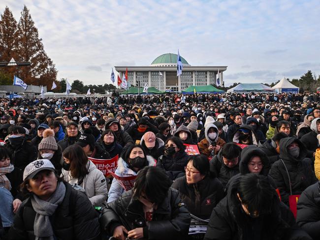 People take part in a protest calling for the ouster of South Korean President Yoon Suk Yeol outside the National Assembly in Seoul. Picture: AFP