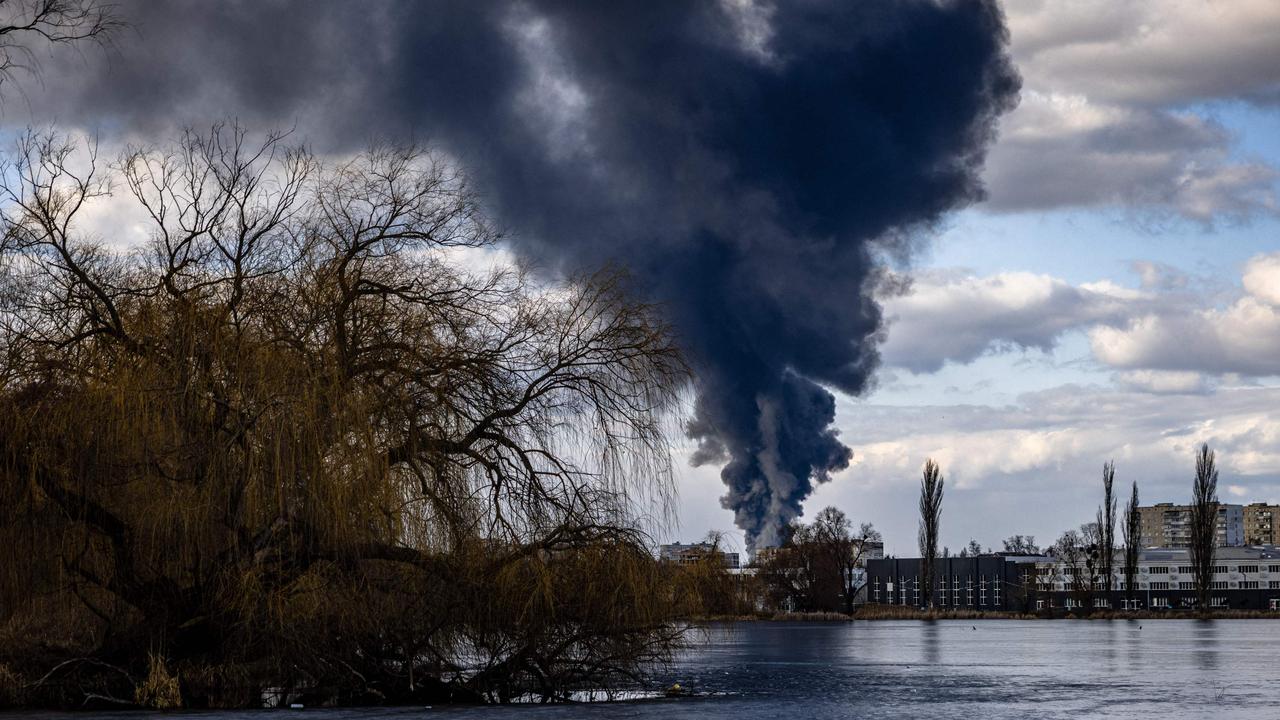 TOPSHOT – Smoke billows over the town of Vasylkiv just outside Kyiv after overnight Russian strikes hit an oil depot. Picture: Dimitar DILKOFF/AFP