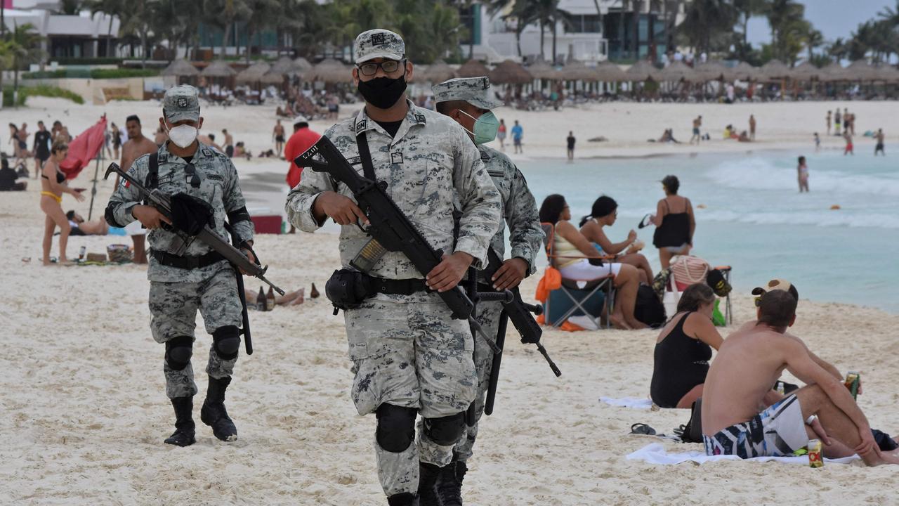 Members of the National Guard patrol a beach. Meanwhile the US State Department issued a travel advisory for American tourists in the area. Picture: Elizabeth Ruiz/AFP