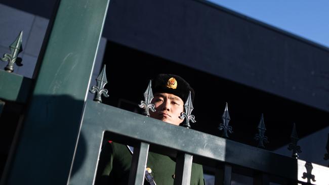 A Chinese paramilitary policeman stands guard at the Australian embassy in Beijing. Picture: AFP