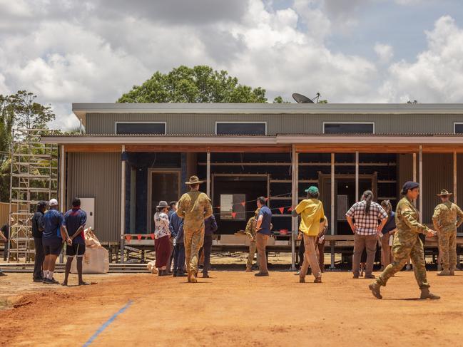 Defence and distinguished guests view the soon-to-be independent Youth Centre in Gapuwiyak NT. Picture: Floss Adams.