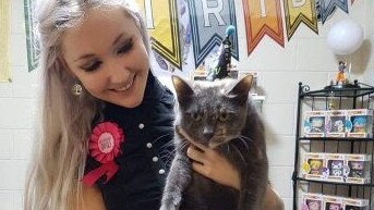 Toyah Cordingley with the pet cat she buried at Wangetti Beach, the same location she was found murdered. Photo: Supplied.