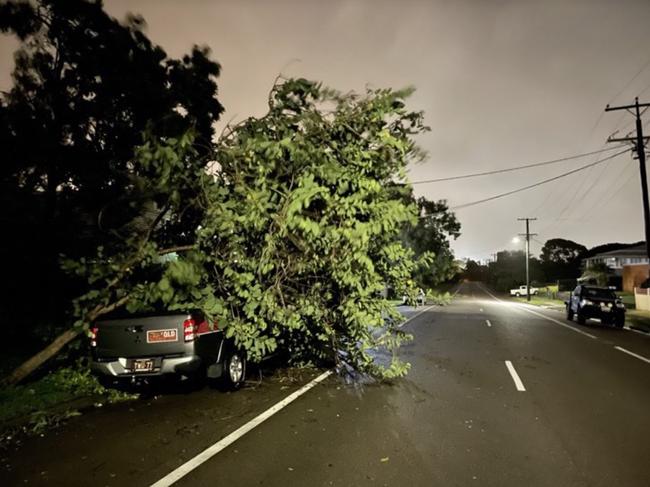 A tree came down on a car in Townsville as Tropical Cyclone Kirrily crossed. Photo: Evan Morgan