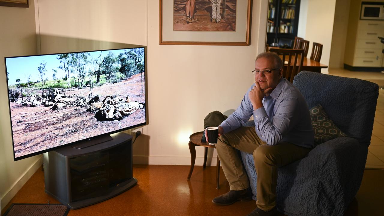 The PM was shown a video of flood devastation during the trip. Picture: Lukas Coch/AAP Image