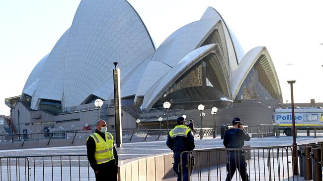 NSW Police and Covid cleaners arrive at the Sydney Opera House after the iconic venue allegedly had a worker test positive for Covid-19. Picture: NCA NewsWire / Jeremy Piper