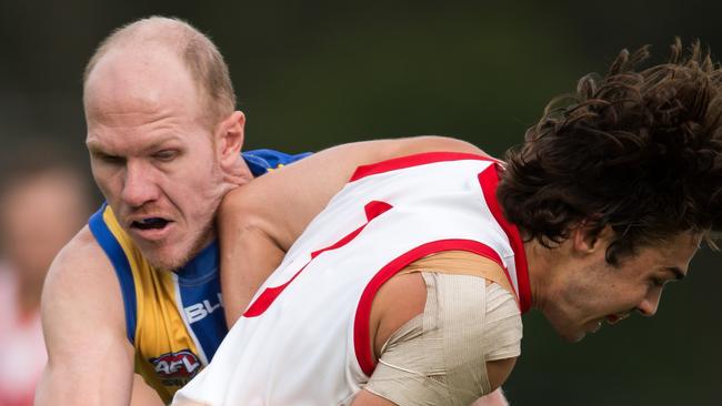 Kieran Emery of the Eagles, left, who won the Podbury Medal for Best on Ground in the final.