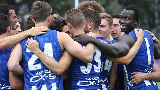 Majak Daw with his teammates at the club’s team photo day. Picture: David Caird