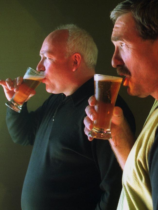 Buckley shares a drink with Peter Bosustow in 2002.