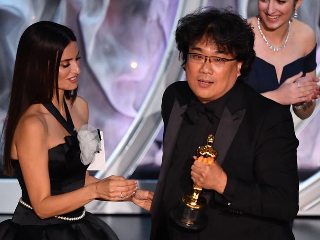 Penelope Cruz, left, with South Korean director Bong Joon-ho, as he accepted the Oscar for Best International Feature Film. It went on to win Best Picture. Picture: AFP