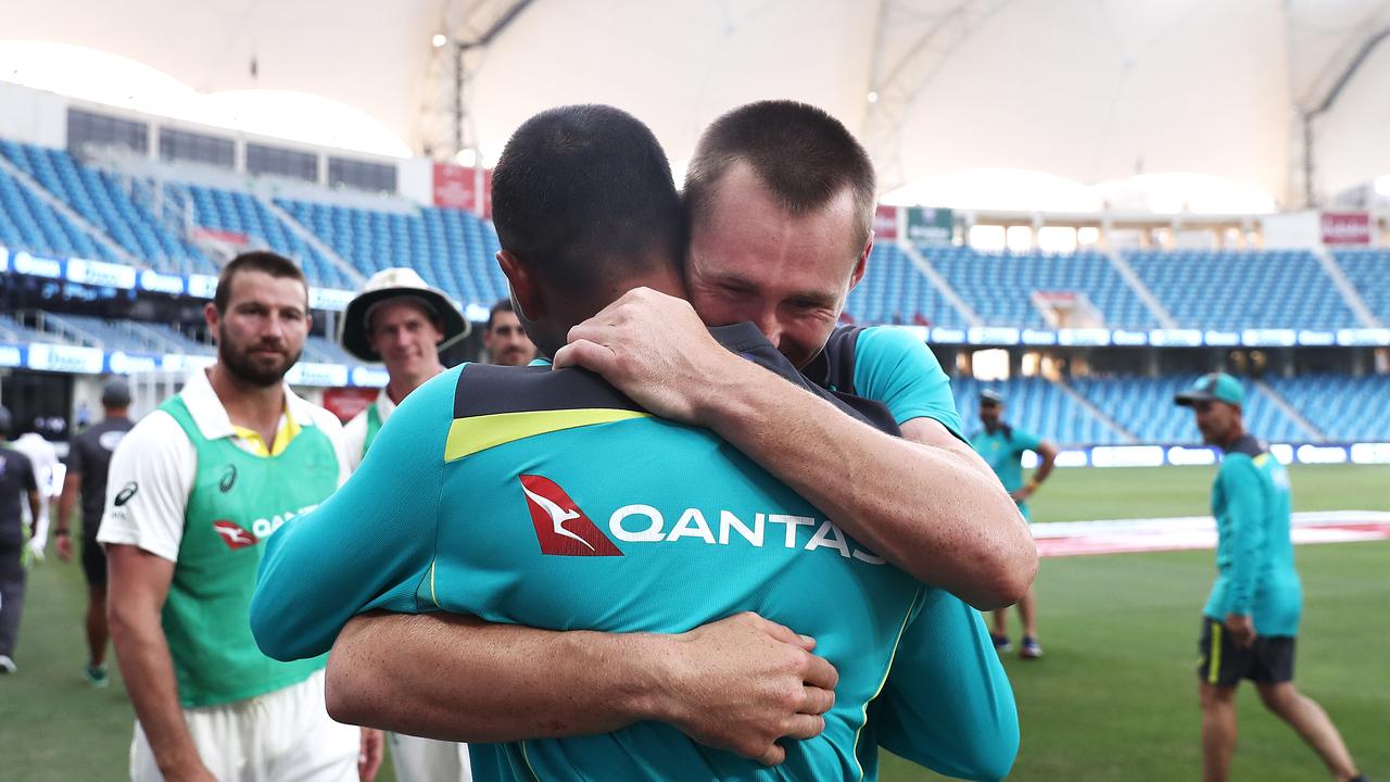 Usman Khawaja and Marnus Labuschagne celebrate after Australia held on to draw the test match.