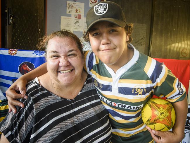 Camellia Cottage youth worker Mel Livermore gets in the scrum with Ashdon Randall. The cottage donated $100 towards Ashdon's upcoming rugby tour to New Zealand.