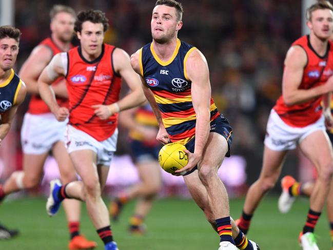 Crows midfielder Brad Crouch handballs against Essendon this year. Picture: AAP IMAGE/DAVID MARIUZ