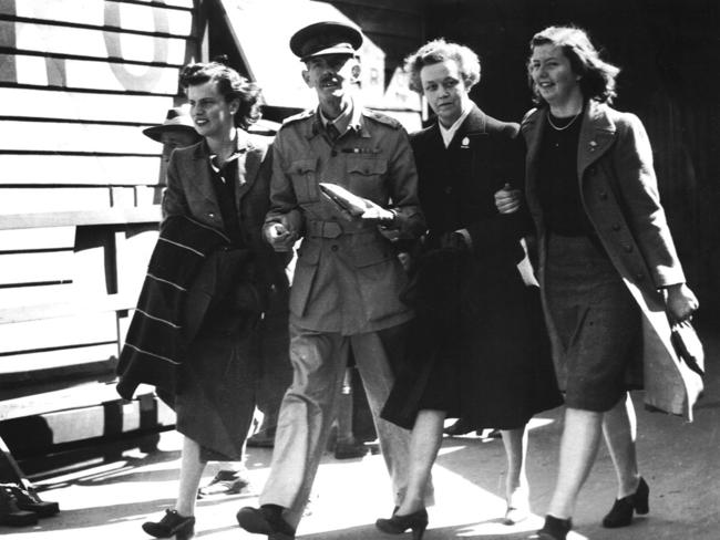 SA army soldier Prisoner of War, Brigadier Arthur Blackburn with daughter Rosemary, wife Rose and daughter Margaret after being reunited at Melbourne Airport's Spencer Street station in Melbourne in 1945, after his release from Japanese prison camp following their surrender in World War II.