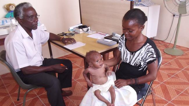 Dr Nuli Lemoh treating a patient at the Bo Children's Hospital in Sierra Leone.