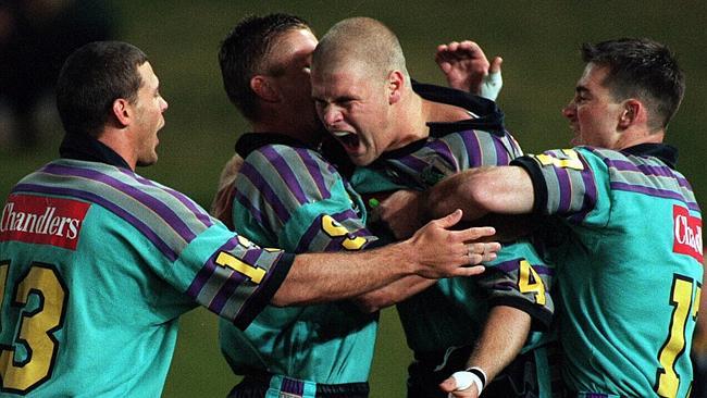 September 5, 1997 — Illawarra vs. Gold Coast Chargers at Parramatta Stadium. Chargers centre (C) Jason Nichol celebrates scoring a try last night. Teammates Jeremy Schloss (13), Jamie Goddard (9) and Darren Anderson (R) share the delight. Pic: Nick Wilson