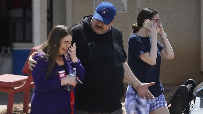 People arrive to look for survivors evacuated from the Walmart to an El Paso school. Picture: AP